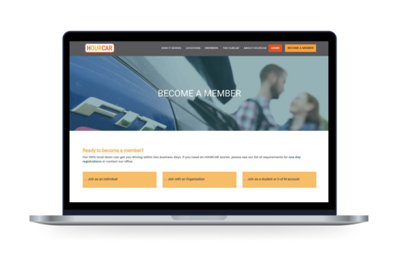 The Hour Car website displayed on a laptop